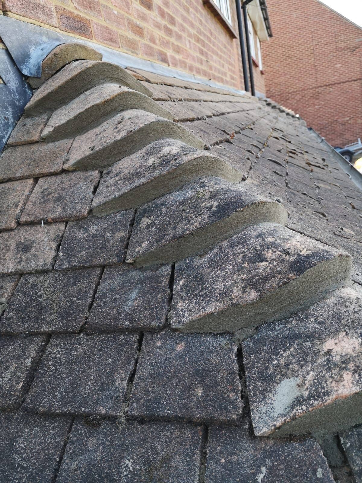 Close-up of freshly repointed hip tiles