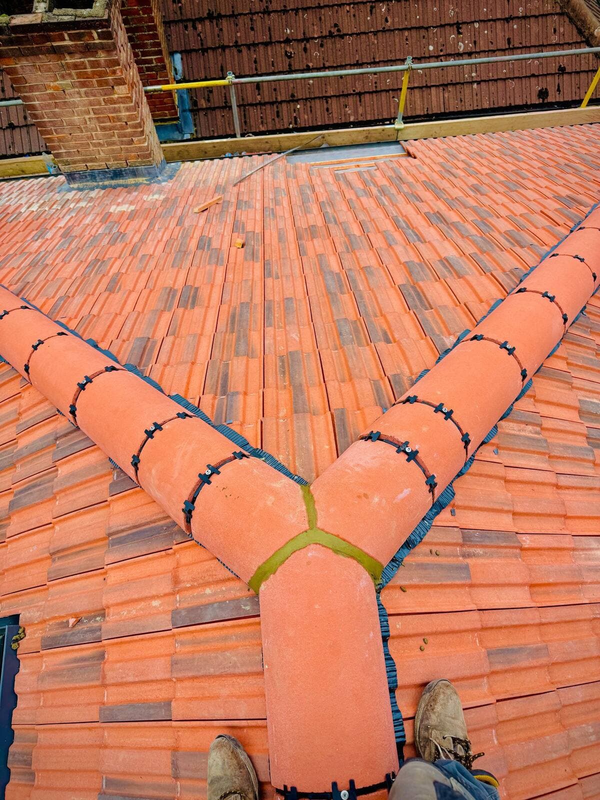 New clay tile roof with neat hip junction, Guildford