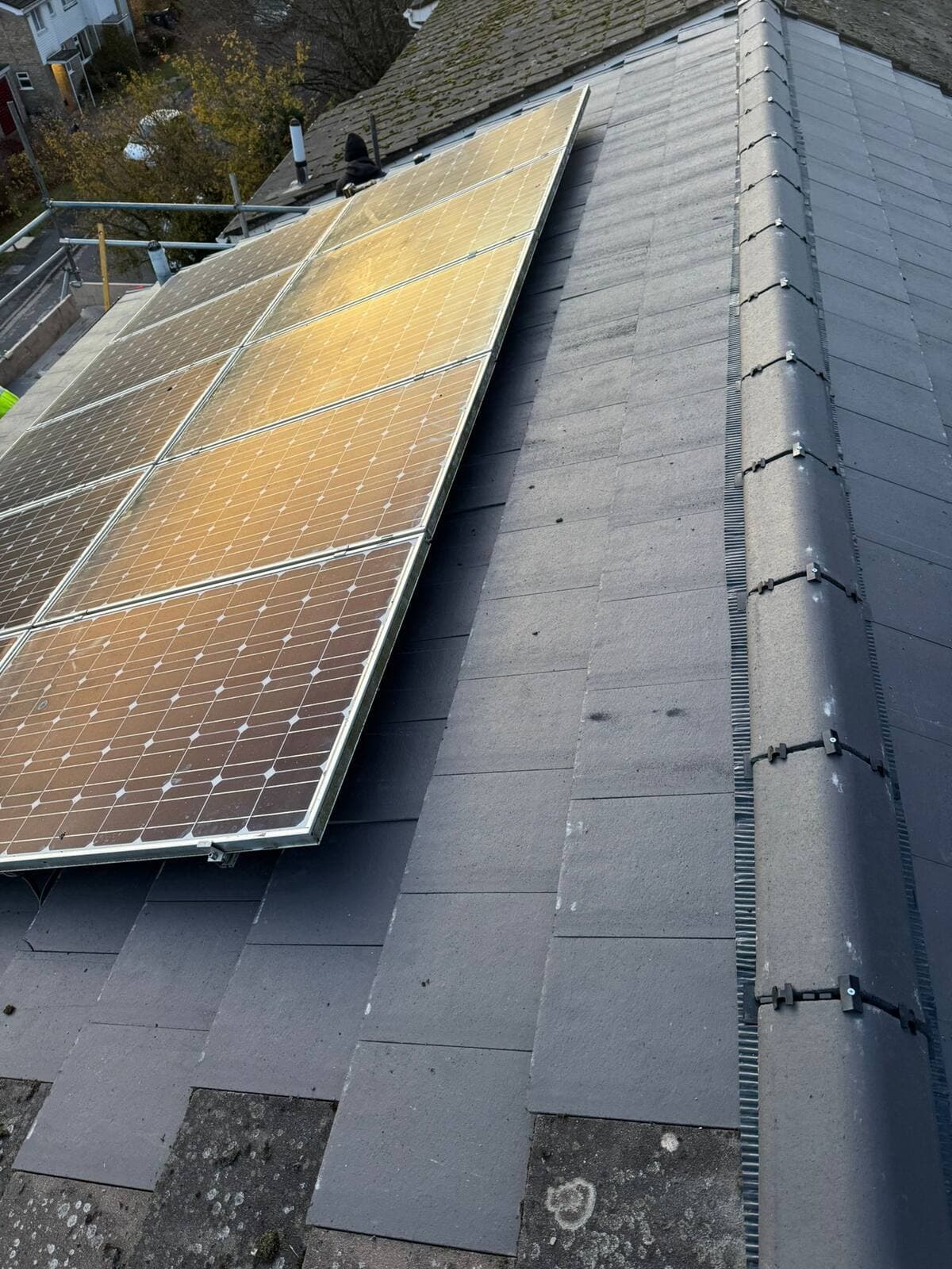 Slate roof with solar panels reinstalled after re-roofing