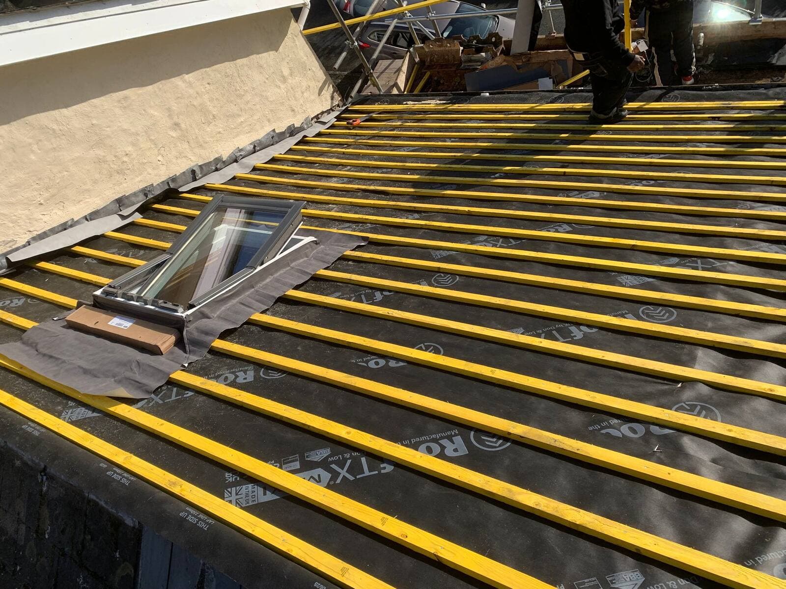 Velux rooflight freshly installed into a tiled roof