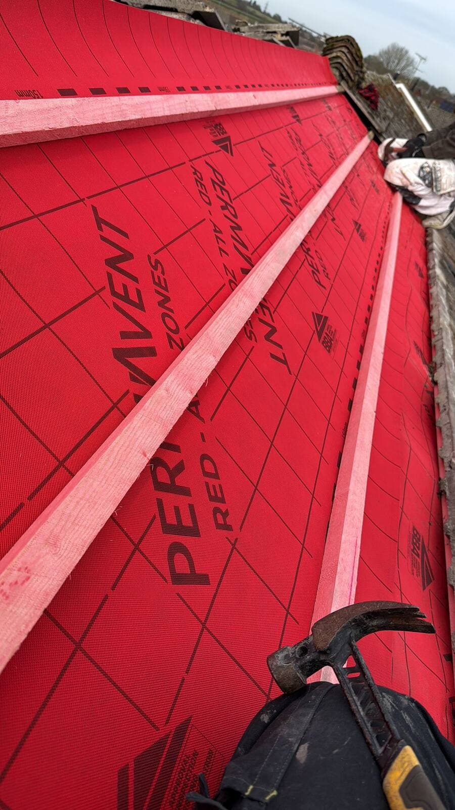 Close-up of a single-ply membrane flat roof upstand detail